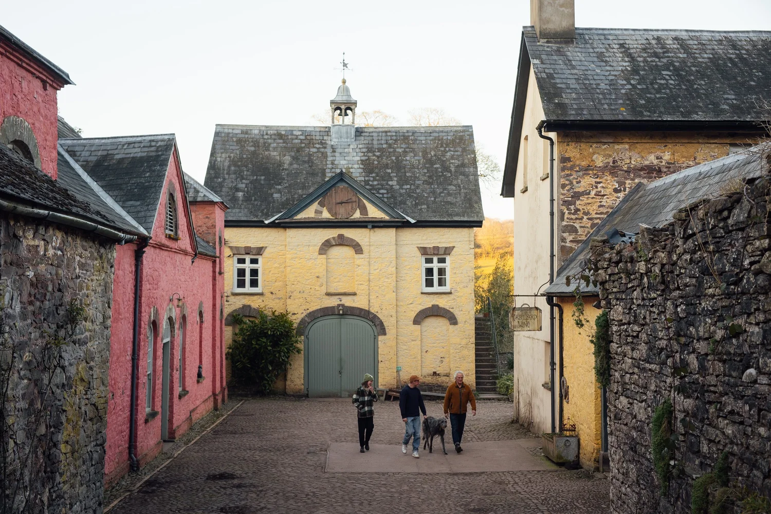 Colourful stone buildings around Penpont’s cobbled courtyard.